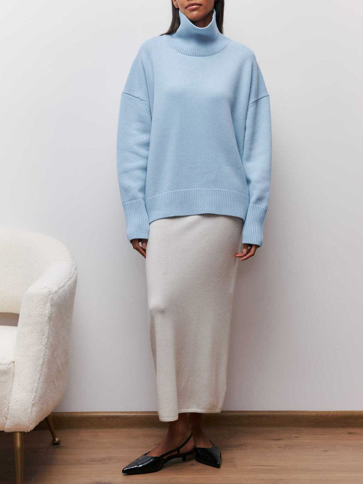 Relaxed fit women's oversized turtleneck sweater, warm & cozy, effortless casual winter style.