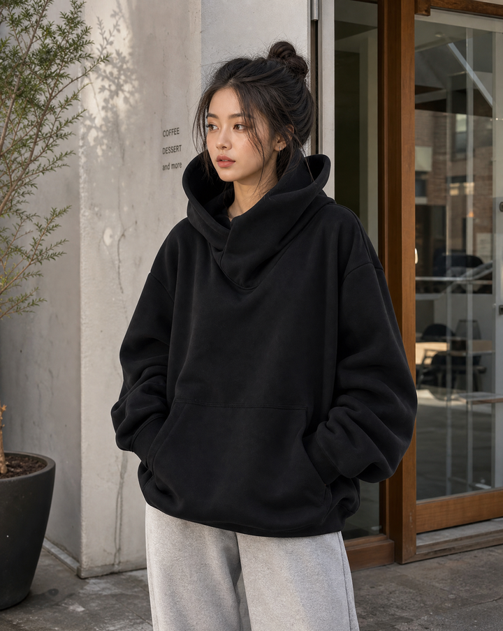 Relaxed fit women's oversized turtleneck sweatshirt for cozy urban streetwear and winter fashion.