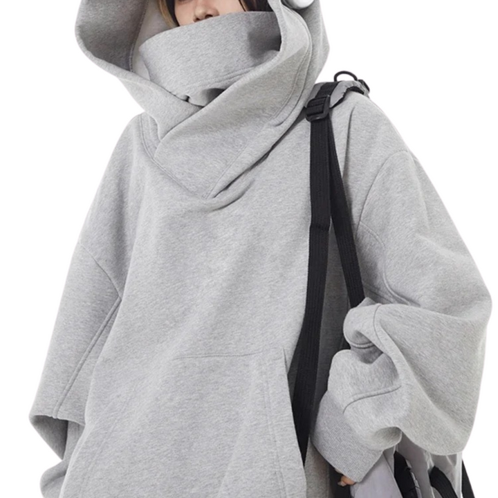 Stylish women's oversized turtleneck sweatshirt, designed for ultimate urban comfort & modern streetwear look.