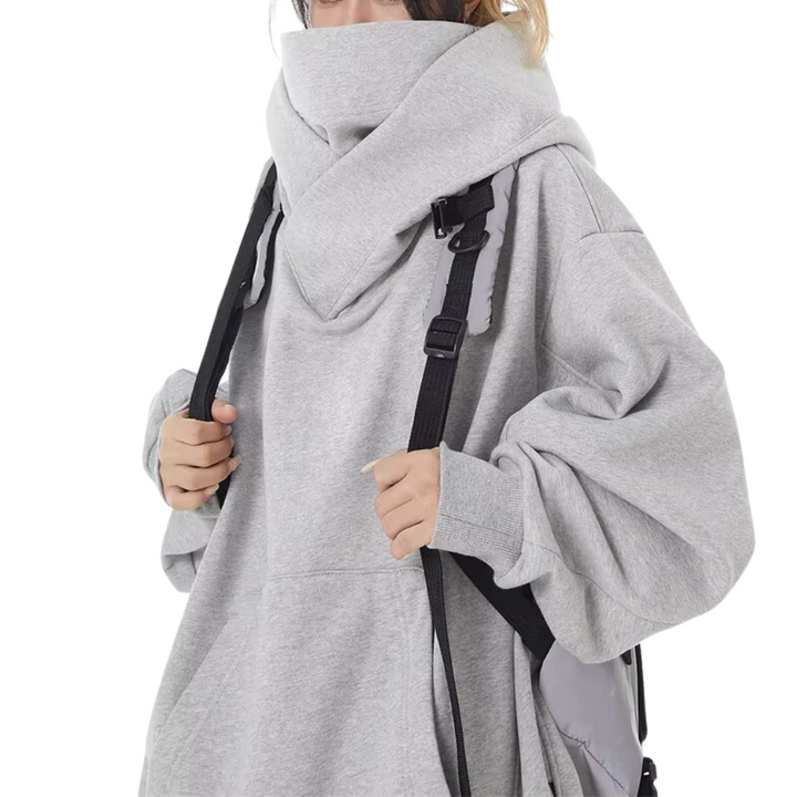 Women's relaxed fit oversized turtleneck sweatshirt, offering warmth & casual style for urban winter outfits.