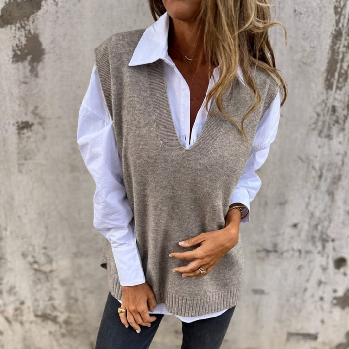 Comfy women's oversized knitted V-neck sweater vest, perfect for versatile fashion layering.