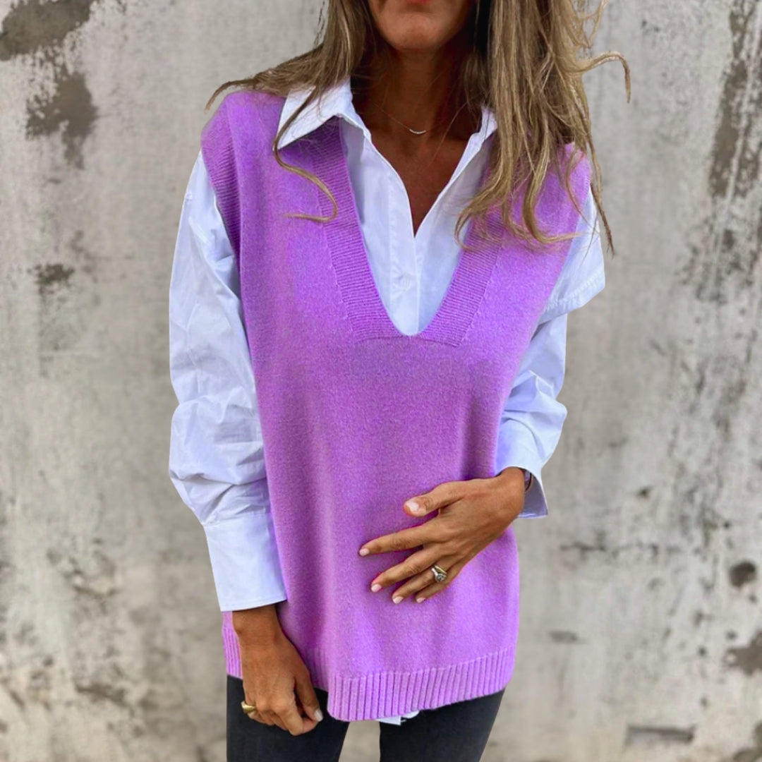 Women's oversized V-neck knitted vest, a versatile sleeveless top for casual or dressed-up layering.