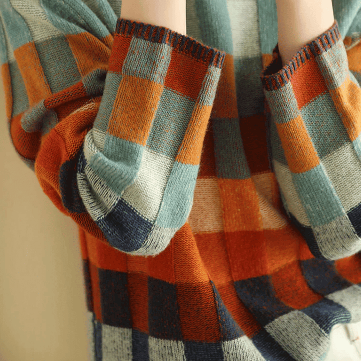 Stylish women's orange patchwork cashmere turtleneck, a luxurious and warm sweater for winter fashion.