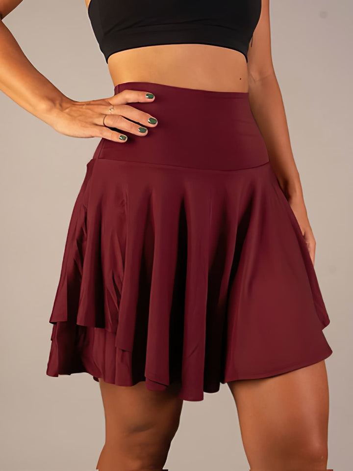 Women's activewear tennis skort, a performance sports skirt with shorts and hidden pockets.