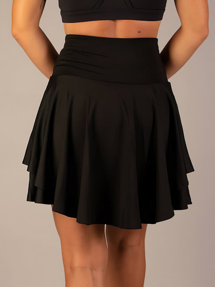Gym-ready women's tennis skirt, a functional skort with shorts & pockets for exercise.