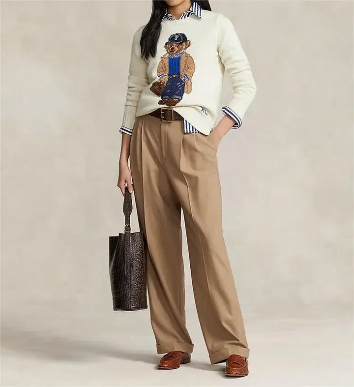Women's playful bear sweater, cozy knit for winter comfort. Long sleeve cute apparel, perfect casual top for holiday style.