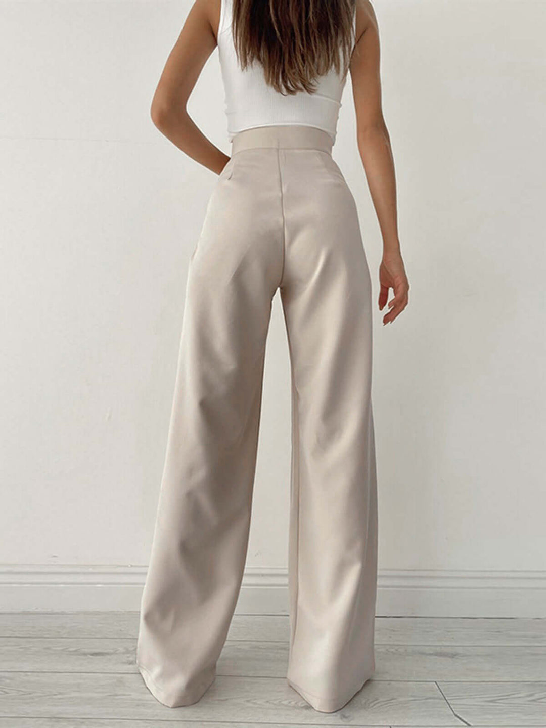 Black pleated high-waist palazzo trousers, wide leg for elegant, comfortable women's fashion.