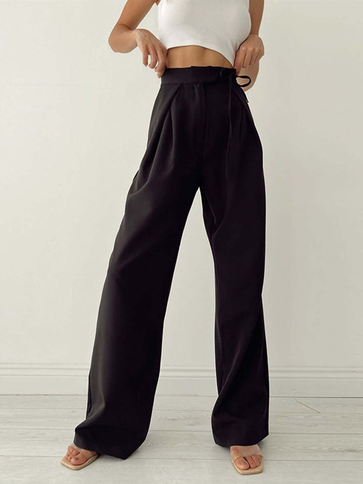 Pleated high-waist women's wide-leg trousers, loose fit palazzo pants for modern, elegant fashion.