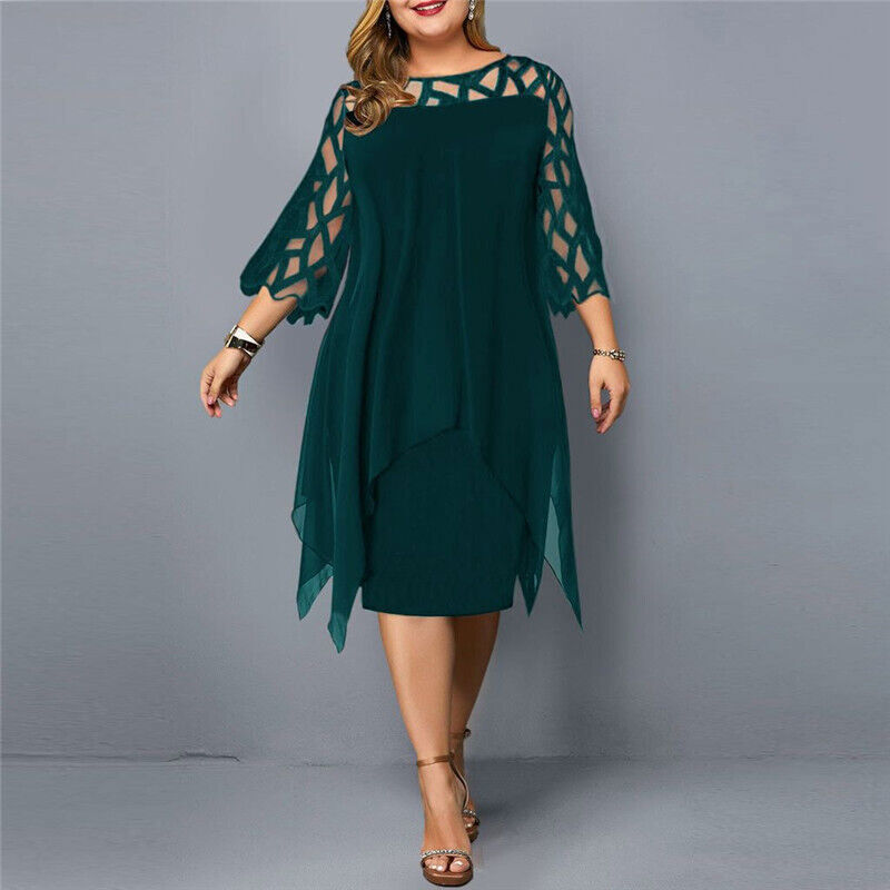 Black plus size flowy midi dress. Classic and refined for elegant curvy women's style.