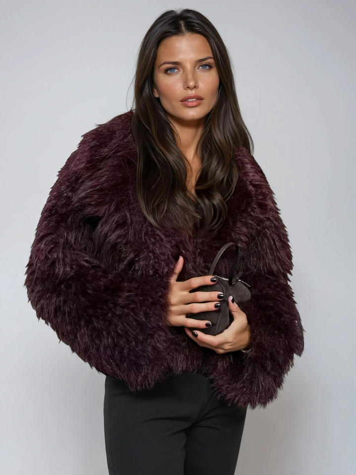 Women's plush cropped burgundy statement coat, chic winter outerwear for a trendy fashion look.