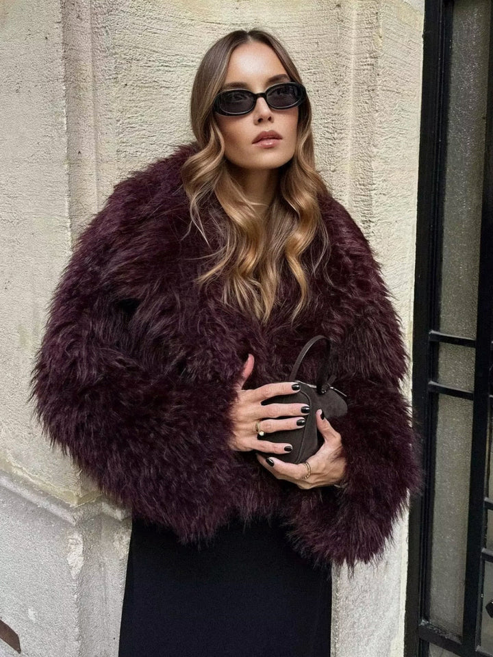 Glamorous women's plush cropped burgundy coat. Trendy winter outerwear jacket for a chic fashion statement.