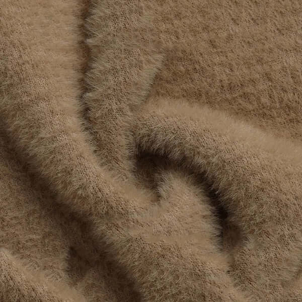 Warm women's plush lined knitted sweater, essential winter apparel for cozy fashion.