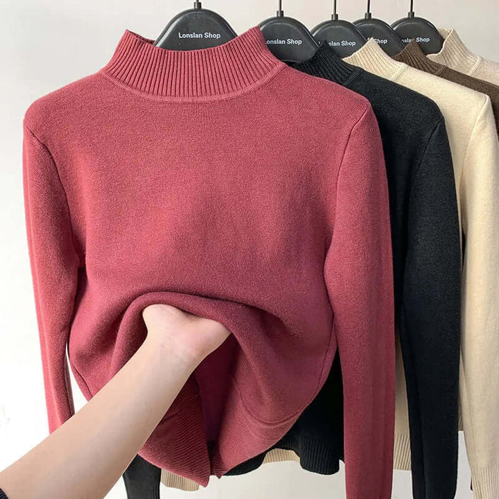 Interior of women's knitted sweater showing soft plush lining, for ultimate warmth.
