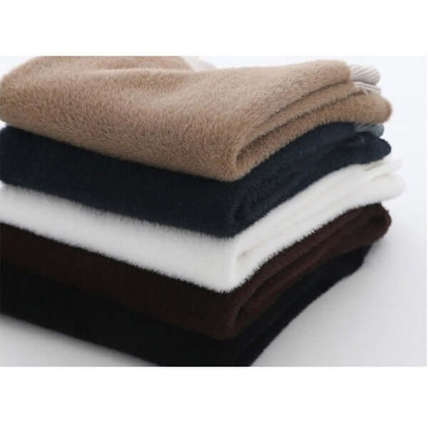 Full view of a warm women's long sleeve knitted sweater, plush lined for winter.
