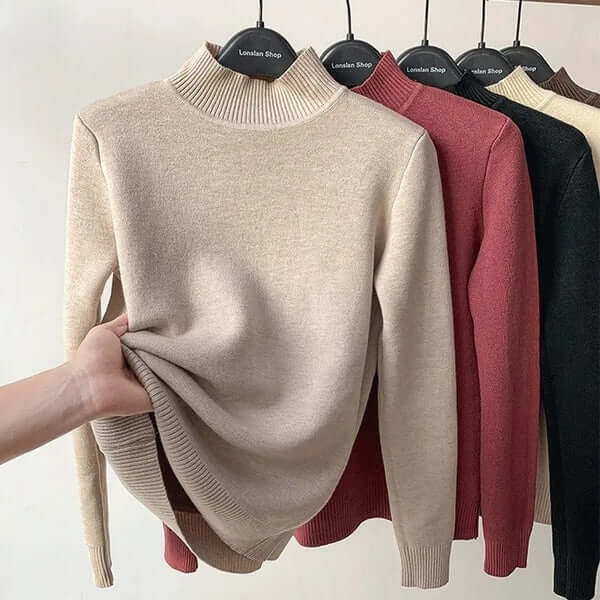 Versatile women's long sleeve knitted top, plush lined, offering warmth & style.