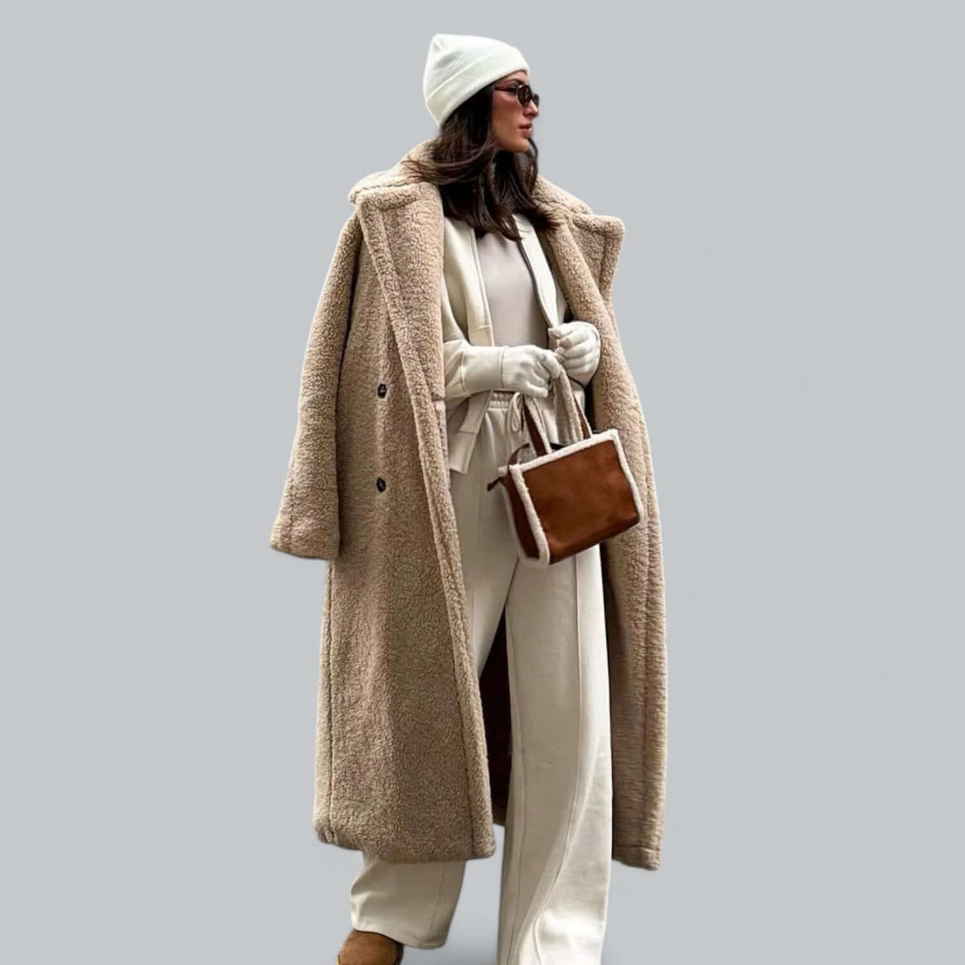 Women's plush teddy faux fur long coat, a chic and cozy winter outerwear piece. Perfect warm jacket.