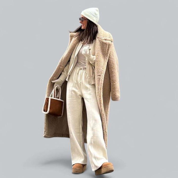 Soft faux fur teddy coat for women, long and plush. A fashionable and warm winter jacket for cold weather.
