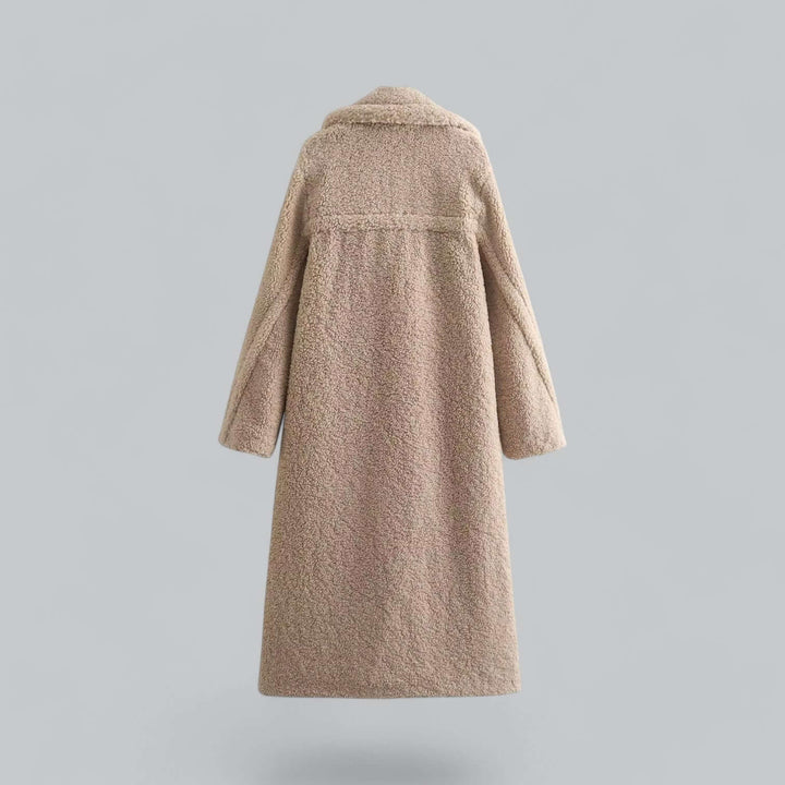 Elegant women's long teddy faux fur coat, a luxurious plush winter jacket. Offers warmth and a chic fashion look.