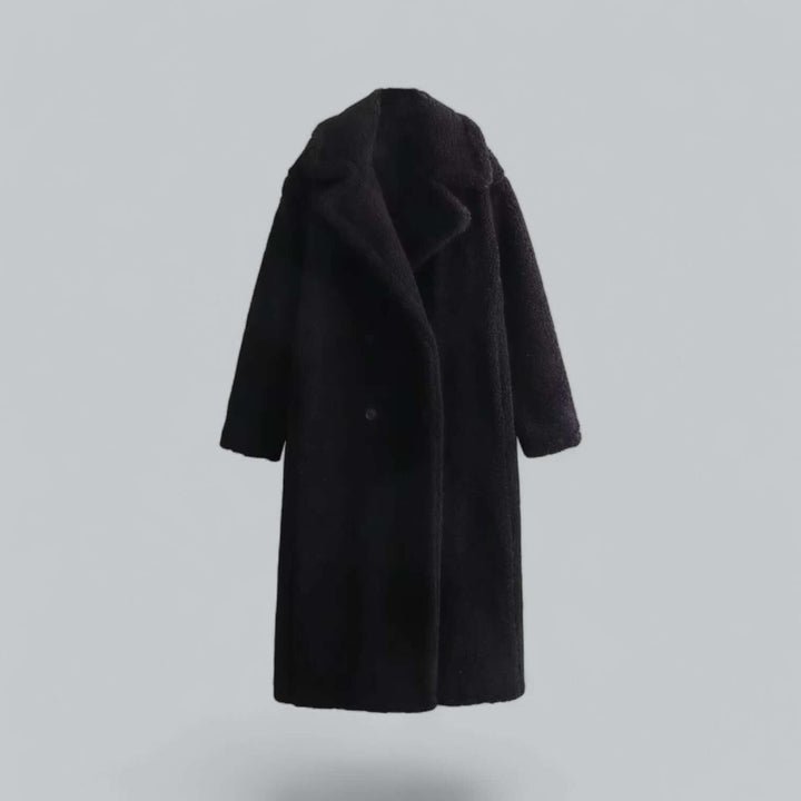 Warm women's winter coat, a long plush teddy faux fur jacket. Fashionable outerwear for cozy and chic style.