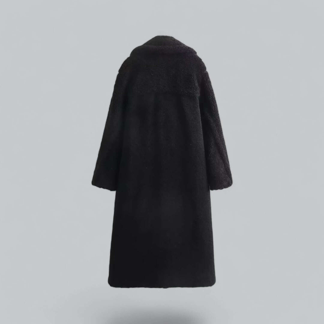 Plush teddy faux fur long coat for women, super cozy and warm. A stylish winter jacket for fashion-forward comfort.