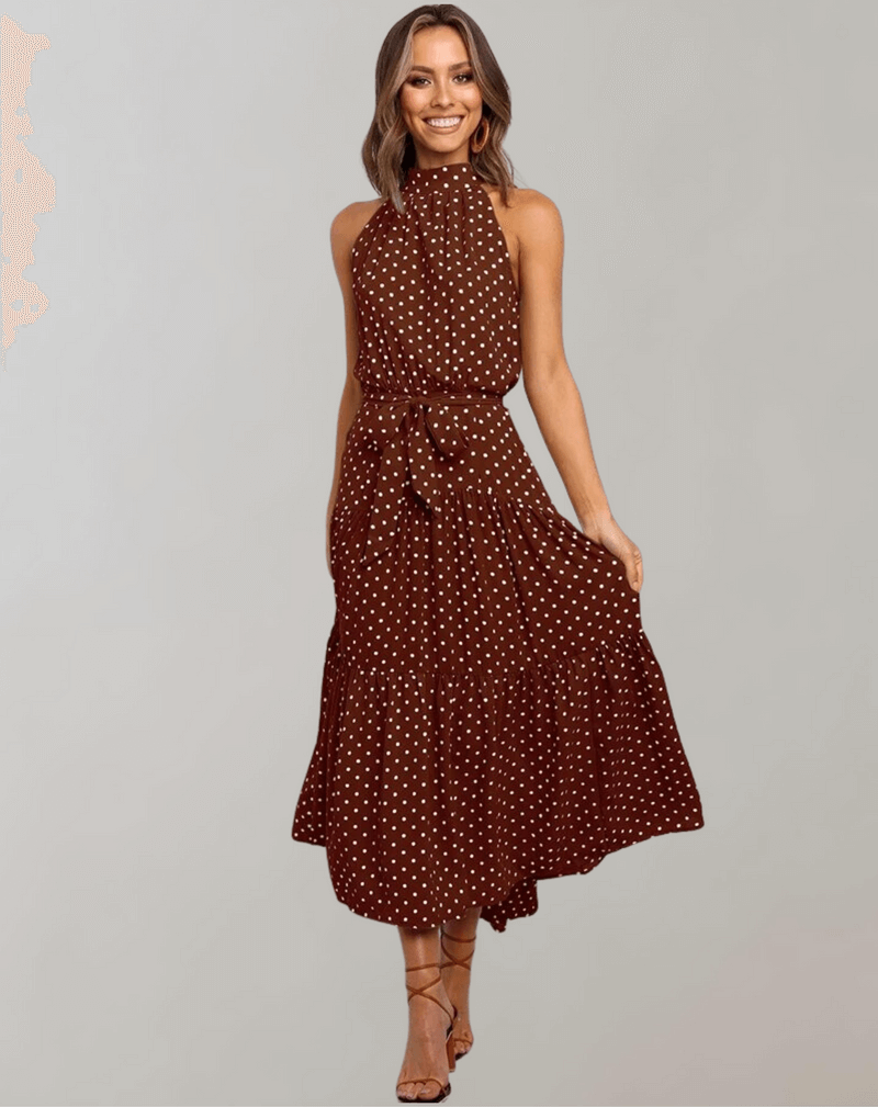 Trendy women's polka dot halter maxi dress, embodying chic summer style.