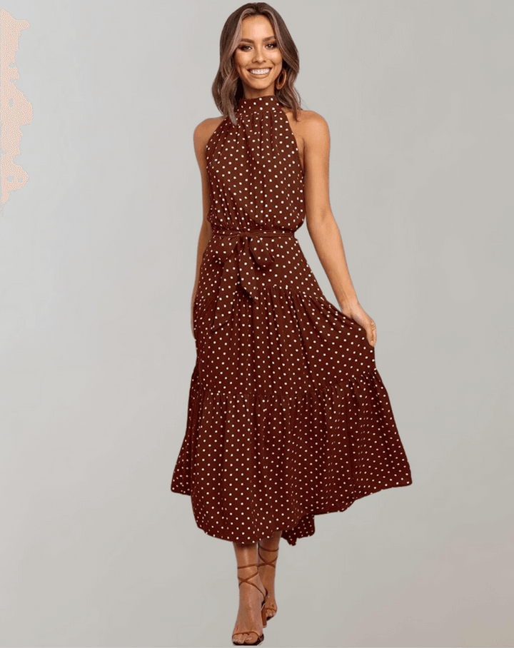 Trendy women's polka dot halter maxi dress, embodying chic summer style.
