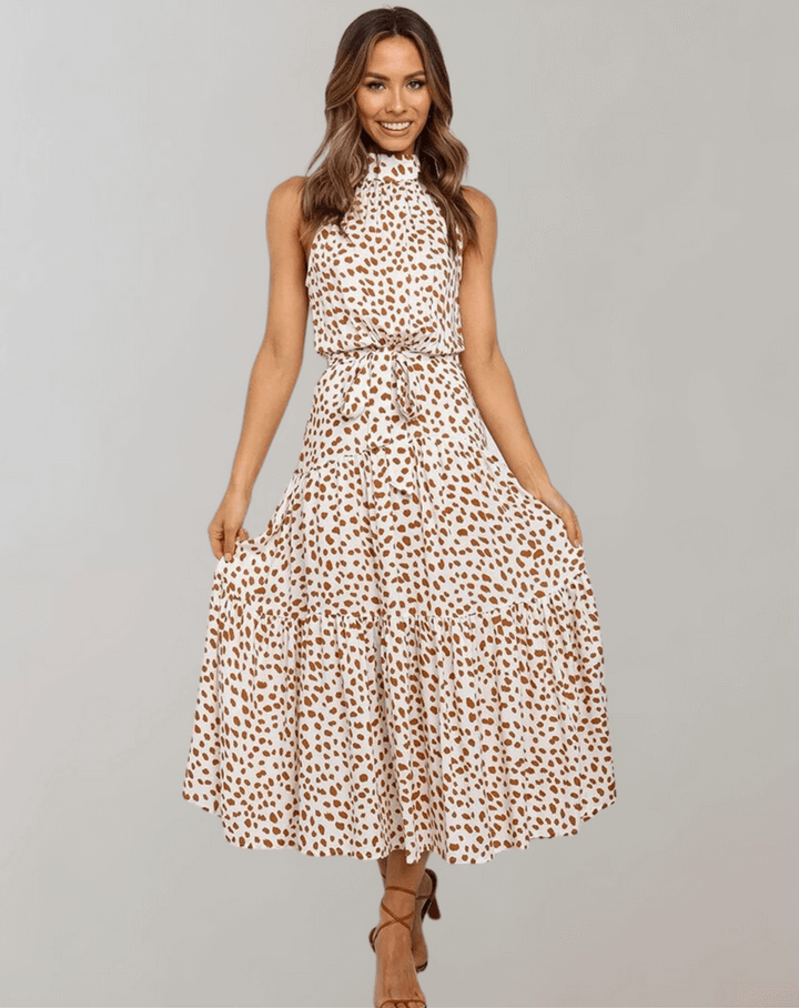 Chic women's polka dot halter maxi dress, a stylish choice for warm weather fashion.