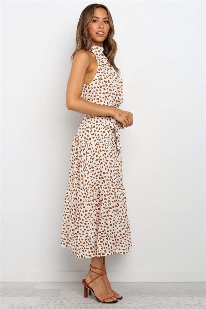 Flowy polka dot halter midi dress, an essential summer women's dress with a flattering silhouette.