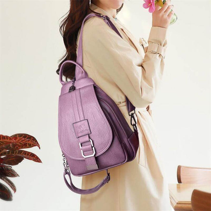 Sophisticated women's water-resistant leather backpack; ideal for business & leisure travel.