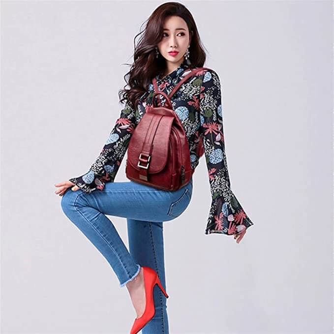 Elegant women's leather backpack, water-resistant & versatile for various social occasions.