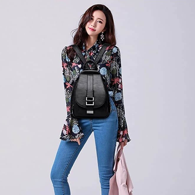 Smart women's water-resistant leather backpack; features spacious compartments for organization.