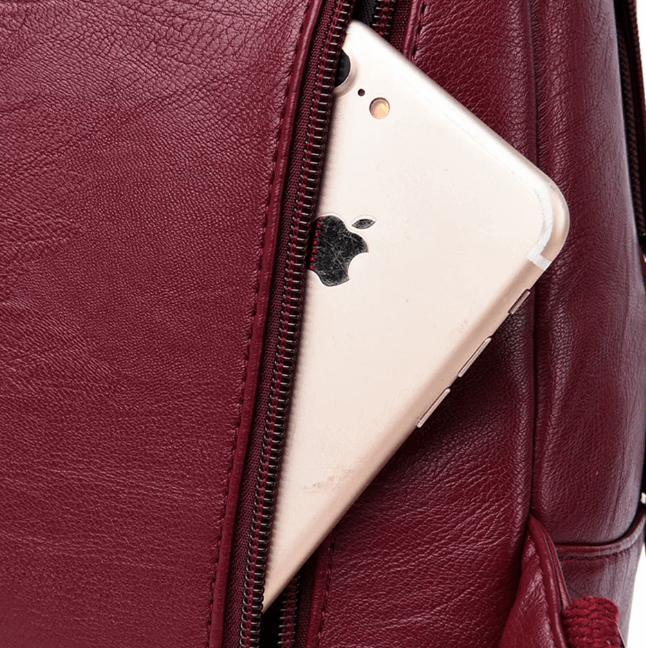 Stylish women's anti-theft leather backpack, water-resistant for secure daily travel & peace of mind.
