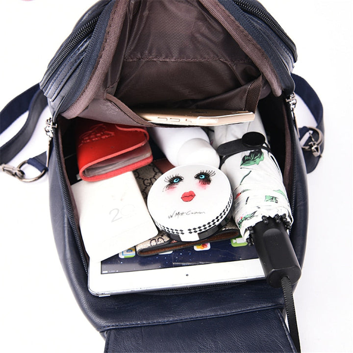 Durable water-resistant leather backpack for women; combines style with everyday function.