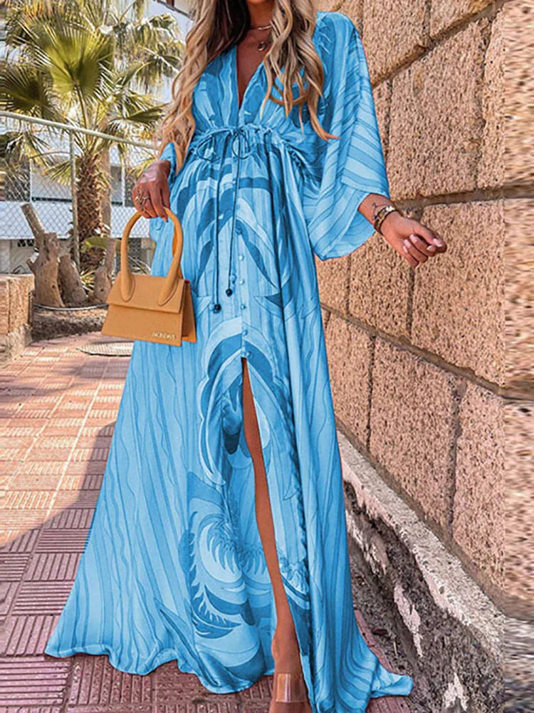 Effortless summer style with this feminine printed beach dress. Ideal vacation wear, resort wear, or casual dress.