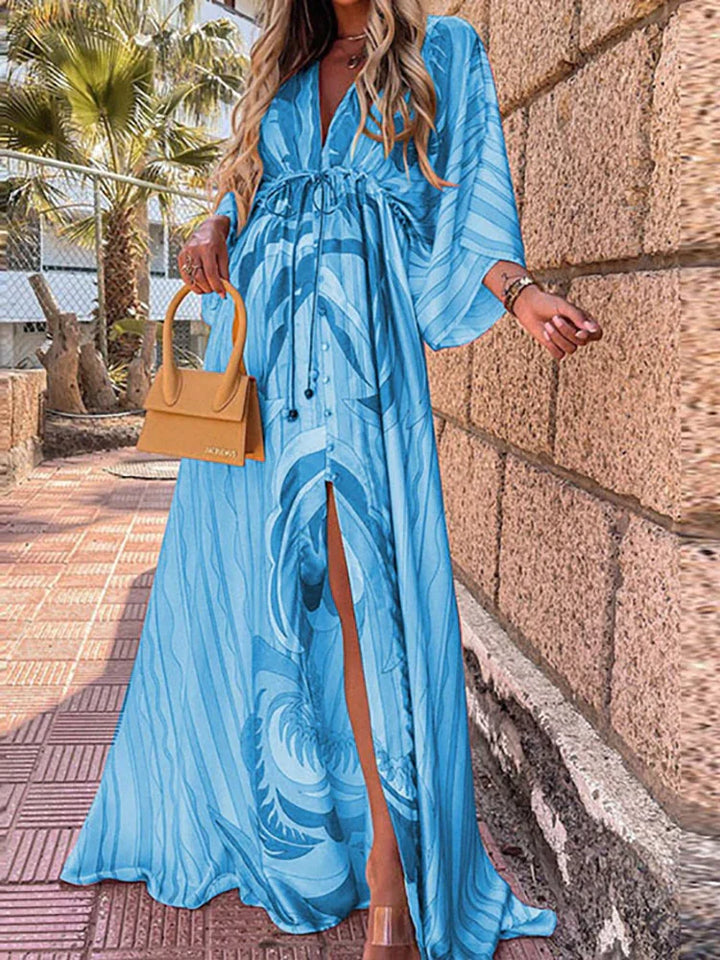 Effortless summer style with this feminine printed beach dress. Ideal vacation wear, resort wear, or casual dress.