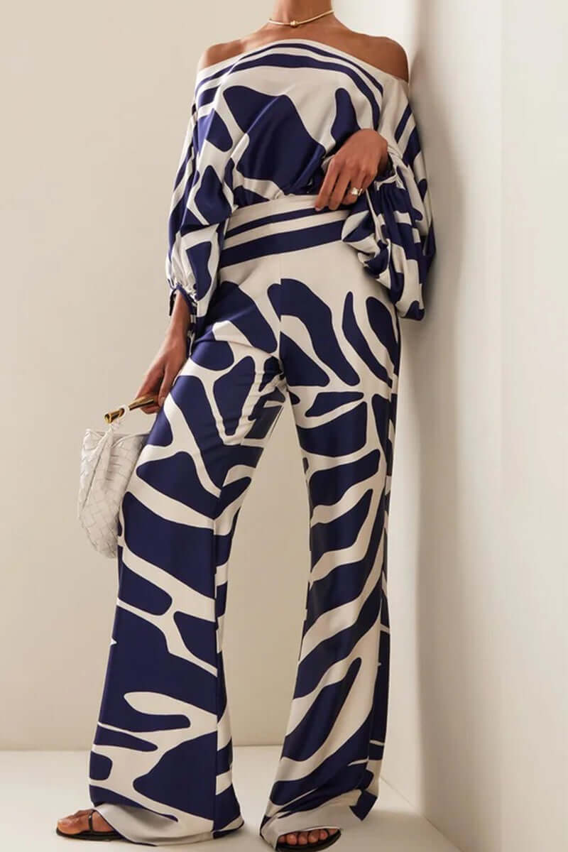 Women's printed off-shoulder long sleeve two-piece set with high waist skirt.