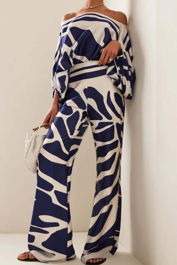 Women's printed off-shoulder long sleeve two-piece set with high waist skirt.