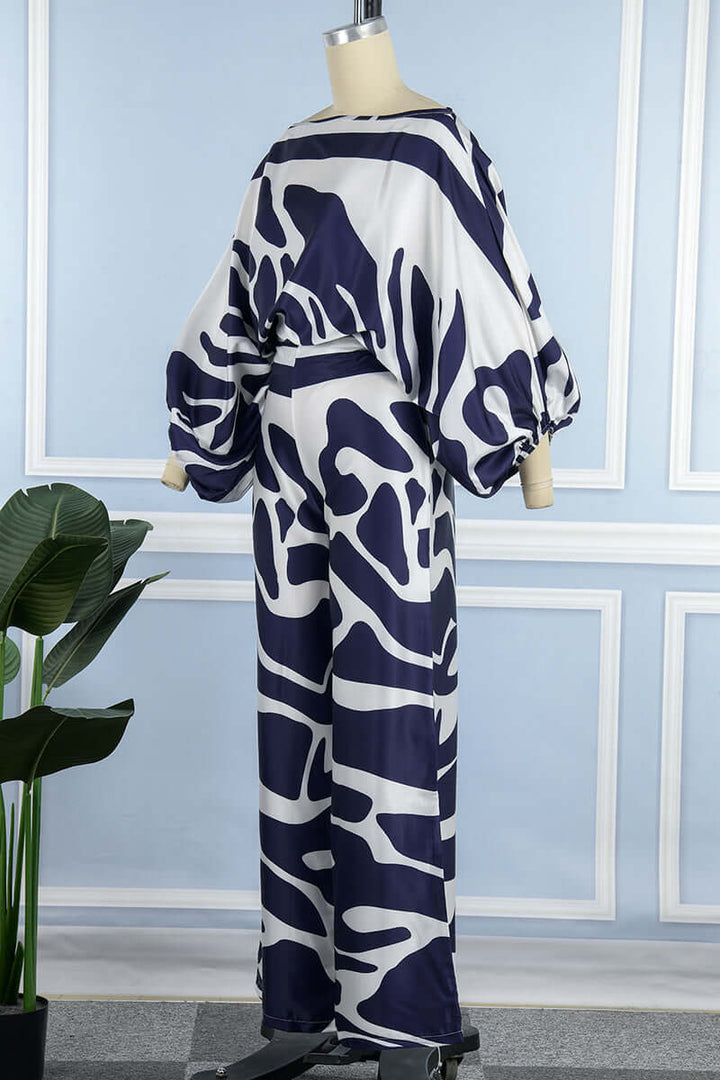 Women's printed off-shoulder long sleeve matching top and high waist skirt set.