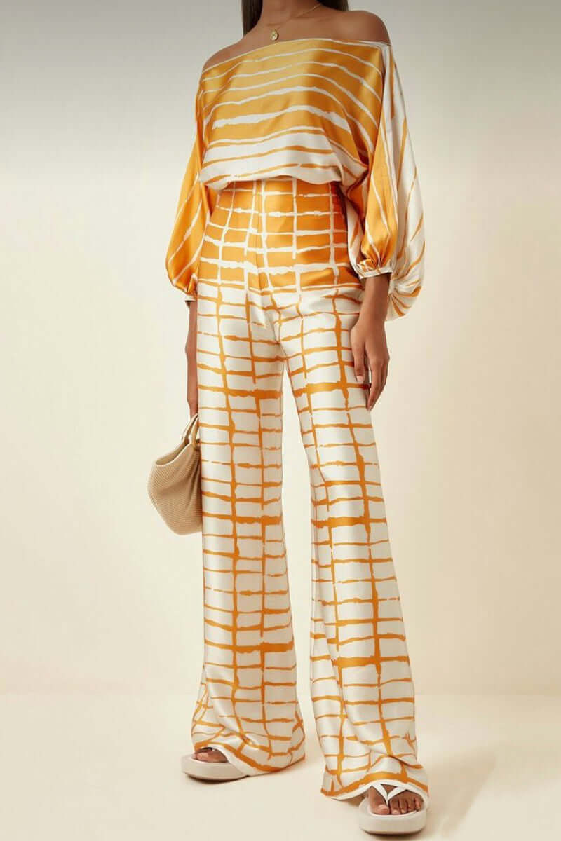 Versatile women's printed polyester off-shoulder top and maxi skirt set.