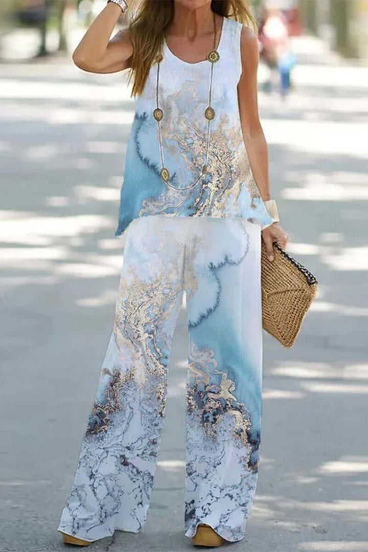 Lightweight polyester women's printed patchwork two-piece set, offering a breezy, comfortable summer look.