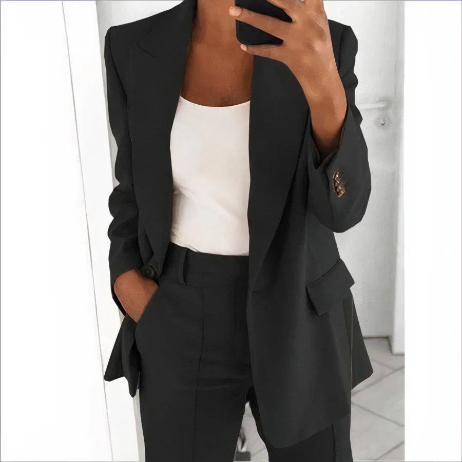 Sophisticated women's blazer & high-waisted pants set. Elegant spring/summer fashion perfect for professional women.