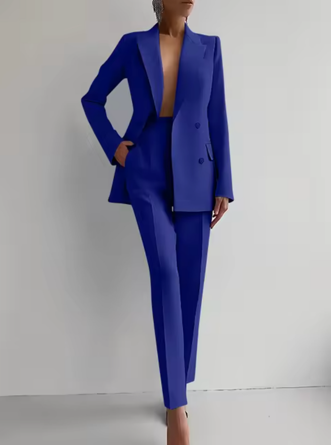 Professional women's workwear pantsuit. Tailored blazer and matching trousers for a sharp office business outfit.