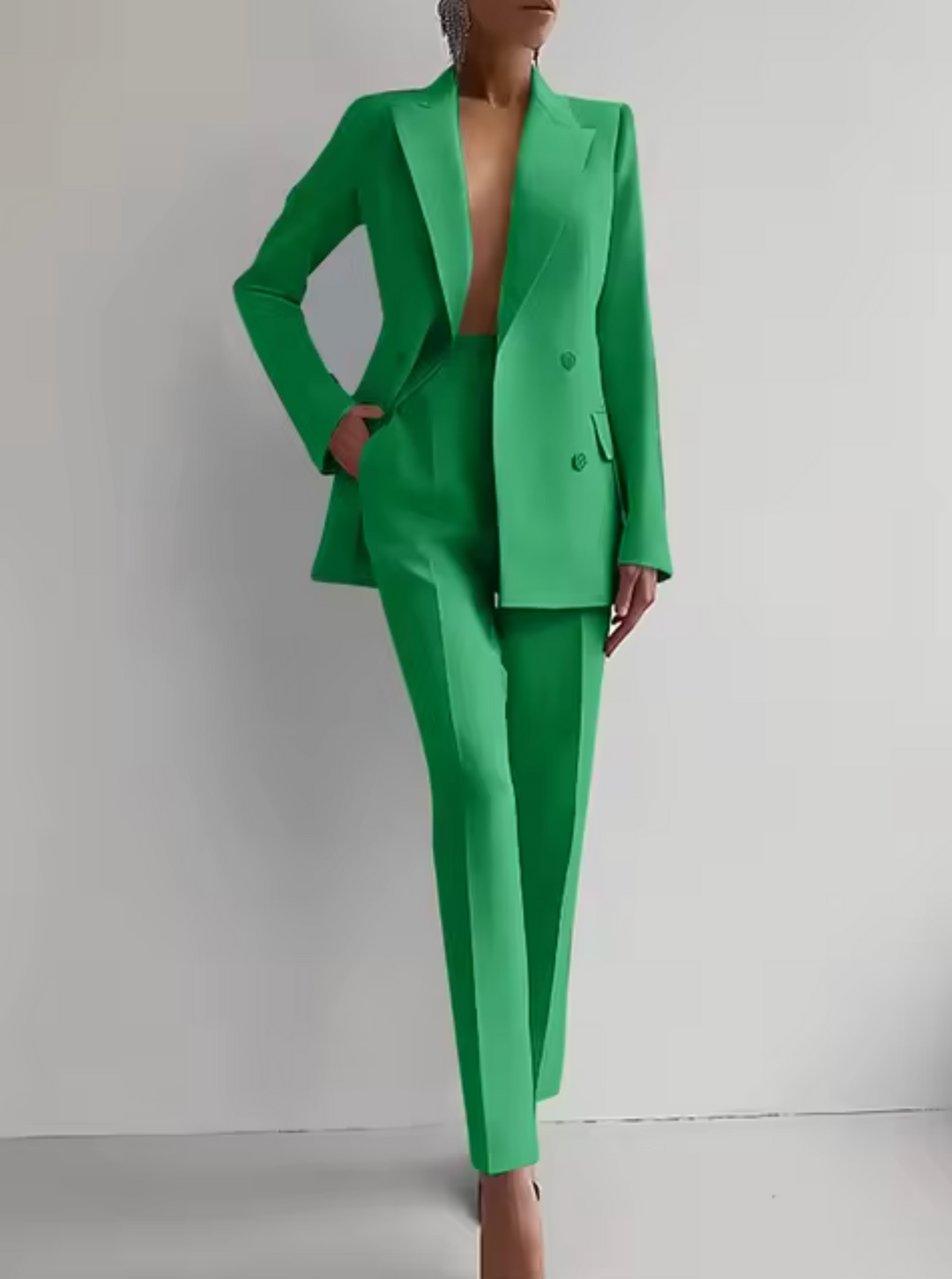 Modern women's tailored pantsuit, a stylish professional blazer and pant set perfect for business fashion.
