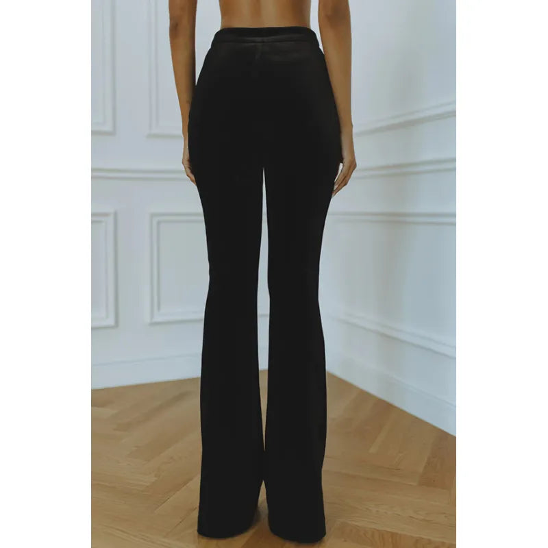 Sophisticated women's workwear co-ord with a structured blazer and flowing flare trousers for office and formal events.