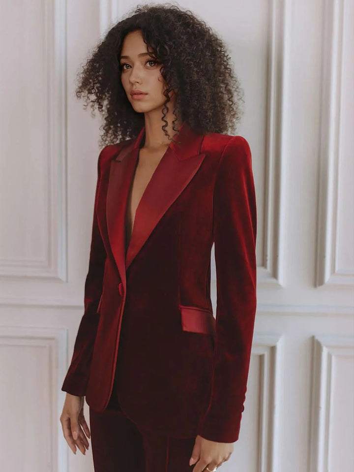 Versatile women's two-piece workwear outfit: tailored blazer and high-waisted flare trousers for business style.