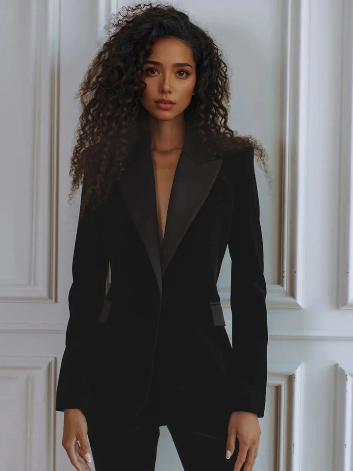 Women's professional co-ord set: smart blazer and elegant flare trousers, creating a polished workwear silhouette.