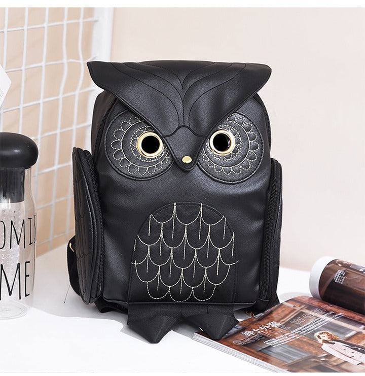 Women's PU leather owl print backpack. Multi-pocket design, front view, stylish and practical.