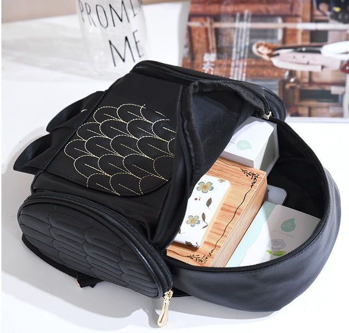 Women's daily fashion accessory: PU leather owl print backpack with a functional multi-pocket system.