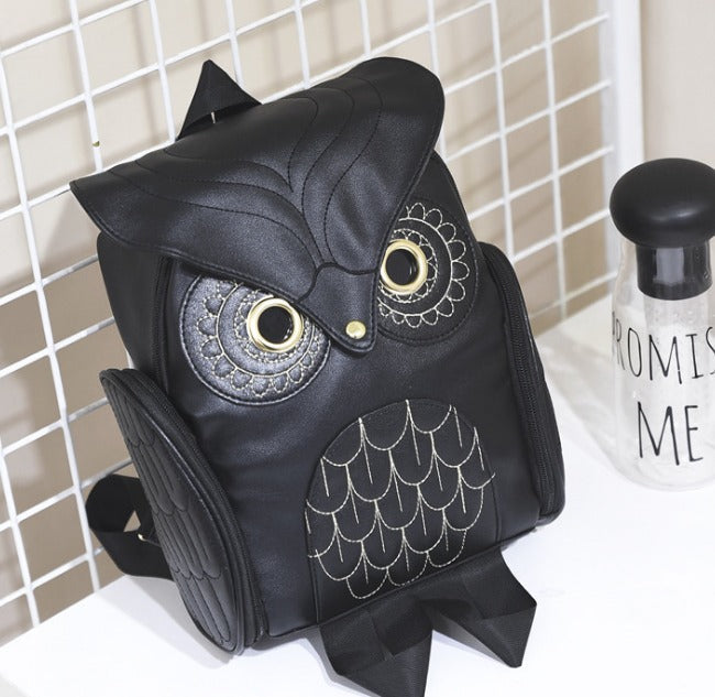 Detailed image of the multi-pocket features on a women's PU leather owl print travel backpack.