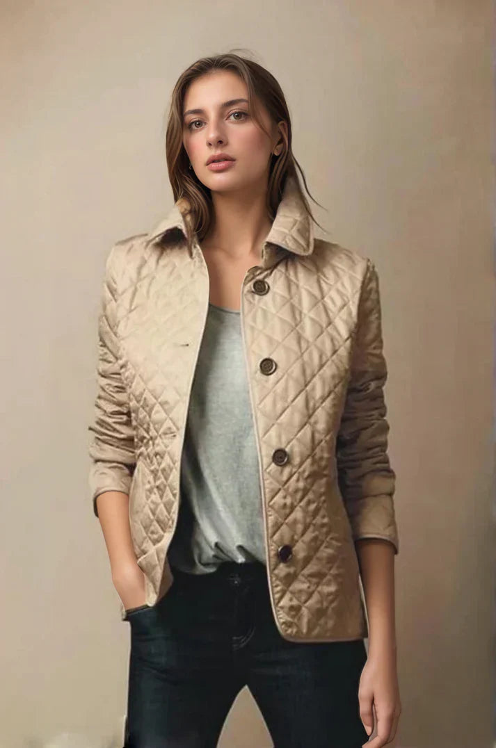Women's quilted button-up jacket in a light color, perfect for lightweight warmth during fall or spring.